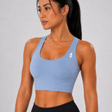 SparkNine Elevate sport-bh - L - lichtblauw - gekruiste rug - push-up effect - stevige ondersteuning - met uitneembare pads
