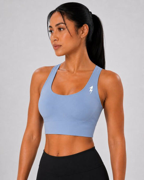 SparkNine Elevate sport-bh - L - lichtblauw - gekruiste rug - push-up effect - stevige ondersteuning - met uitneembare pads