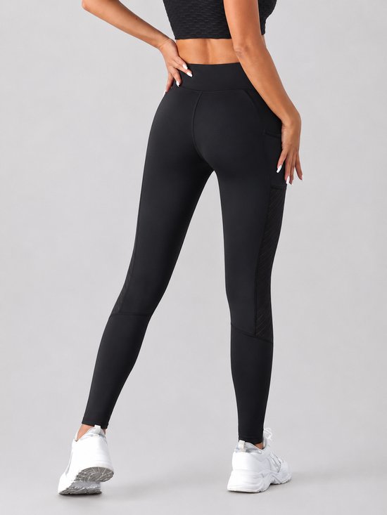 SparkNine Novaflex sportlegging dames - stijlvol & ademend - met zakken - M - zwart - mesh panelen - elastisch - squatproof