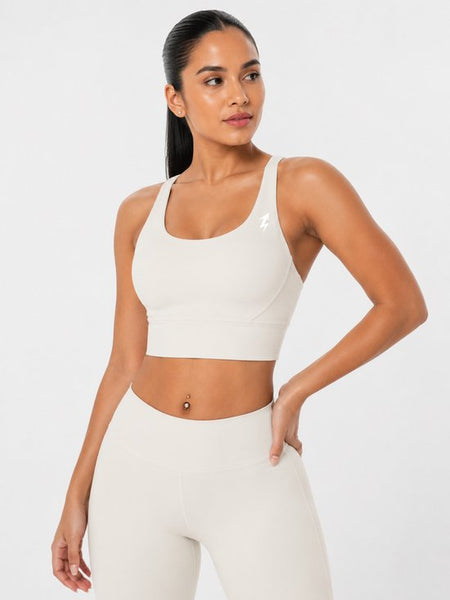SparkNine Elevate sport-bh - L - ivory - gekruiste rug - push-up effect - stevige ondersteuning - met uitneembare pads