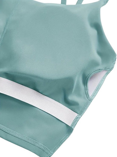 SparkNine Effortless crop top - met verwijderbare vulling - twist back - stijlvol & ademend