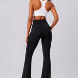 SparkNine Vivaflow flare broek dames - stijlvol V-design - M - zwart - ademend met uitlopende pijpen - sneldrogend & ademend - stretch