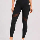 SparkNine Meshmotion sportlegging - dames - met zakken - L - zwart - stijlvolle mesh panelen - telefoon zakken - elastisch - squatproof