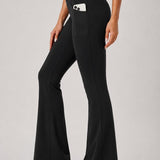 SparkNine Solara flare broek - M - zwart - hoge taille - uitlopend - voorzakken - stijlvol & comfortabel
