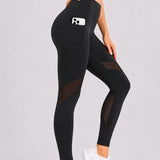 SparkNine Meshmotion sportlegging - dames - met zakken - XL - zwart - stijlvolle mesh panelen - telefoon zakken - elastisch - squatproof