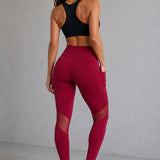 SparkNine Meshmotion sportlegging - dames - met zakken - M - rood - stijlvolle mesh panelen - telefoon zakken - elastisch - squatproof