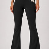 SparkNine Solara flare broek - M - zwart - hoge taille - uitlopend - voorzakken - stijlvol & comfortabel